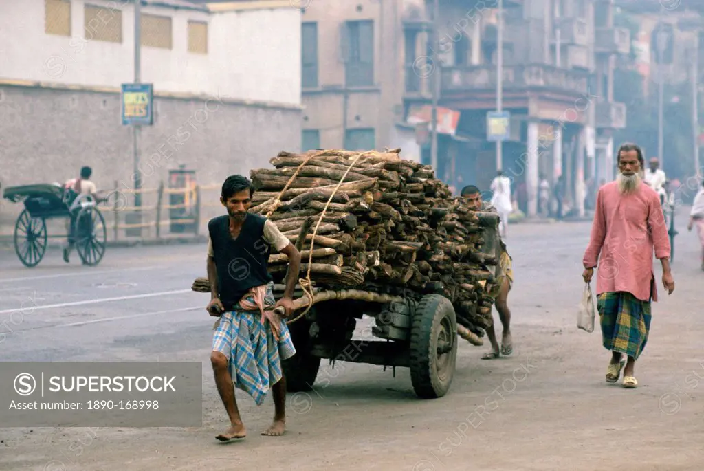 Man transporting wood, Calcutta , India