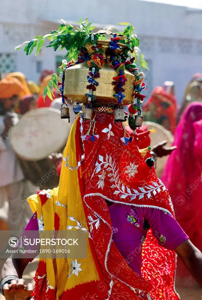 Veiled dancer at a festival in Nalu Village, Rajasthan, India.