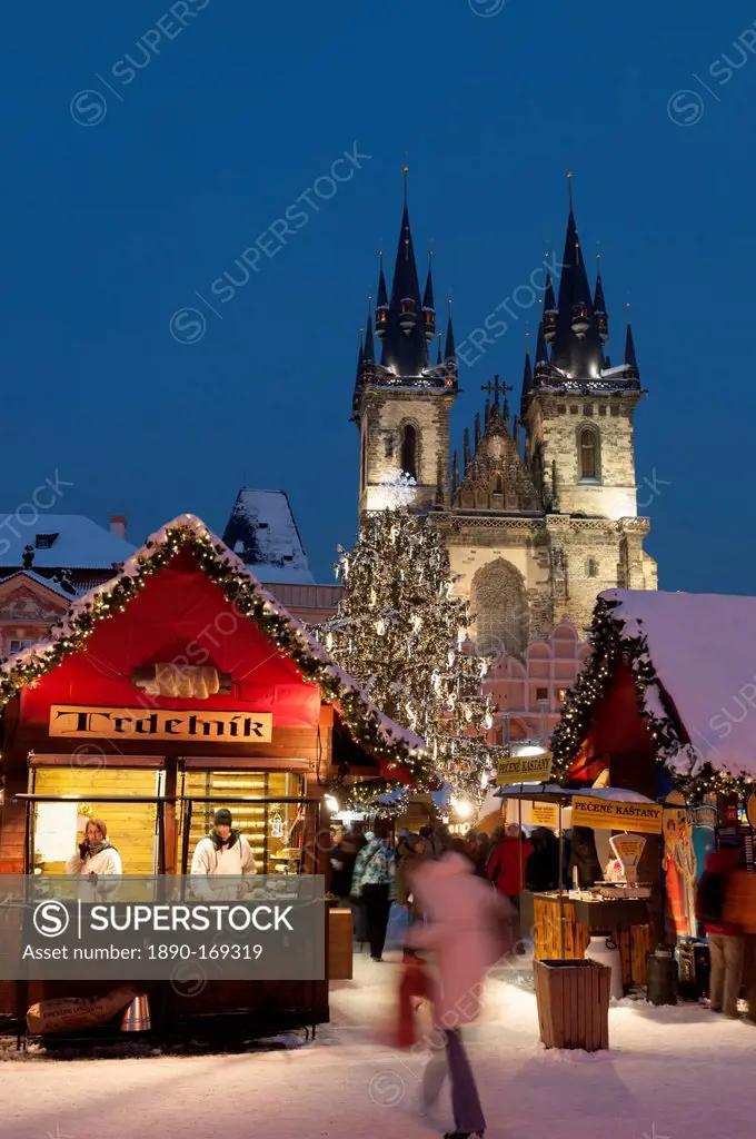 Snow-covered Christmas Market and Tyn Church, Old Town Square, Prague, Czech Republic, Europe