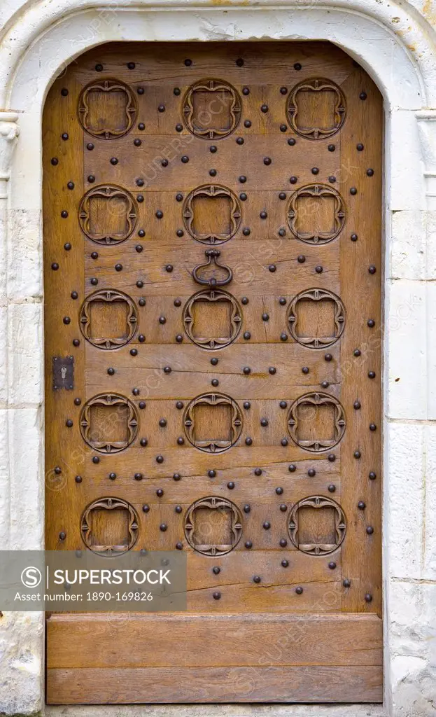 Oak door at Chateau du Rivau, 15th and 16th Century Renaissance architecture, near Chinon in the Loire Valley, France