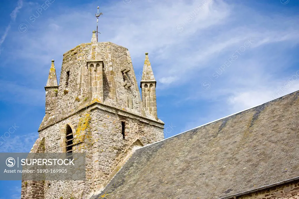 Norman church with unusual rounded square tower in Regneville-Sur-Mer in Normandy, France