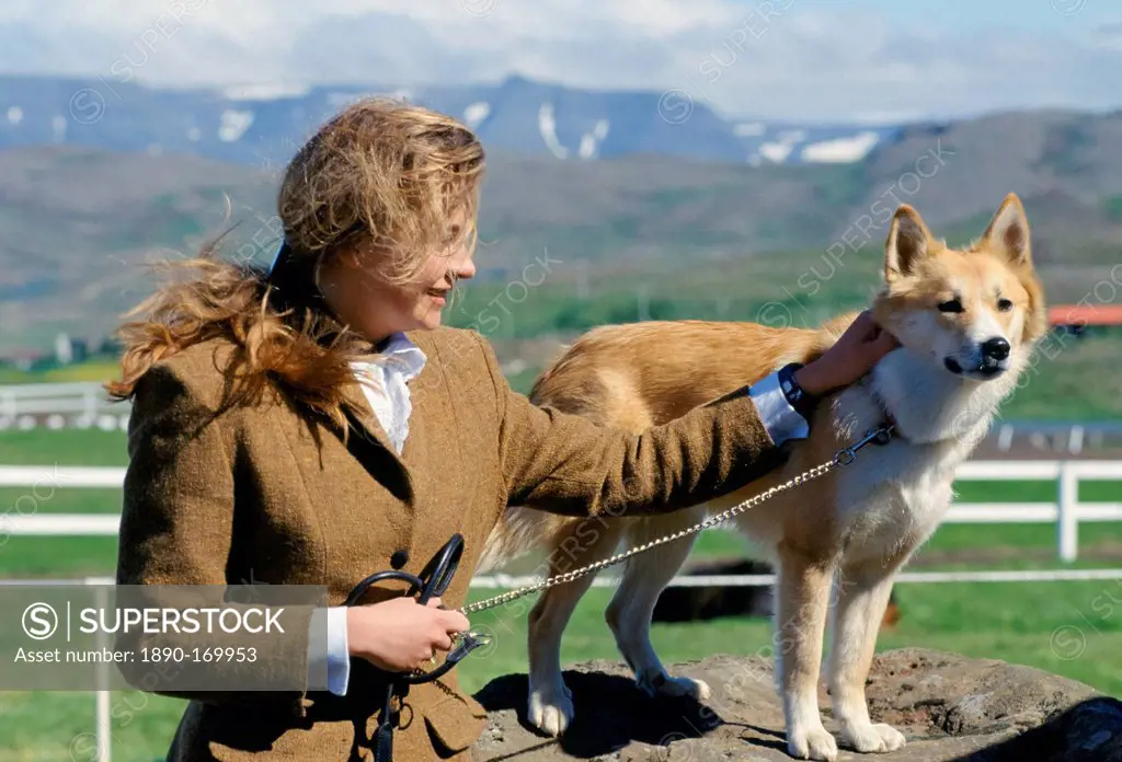 Woman with traditional Icelandic dog at Dalur, Iceland