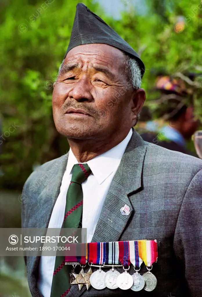 Veteran Ghurka soldier with his war medals proudly displayed in Nepal