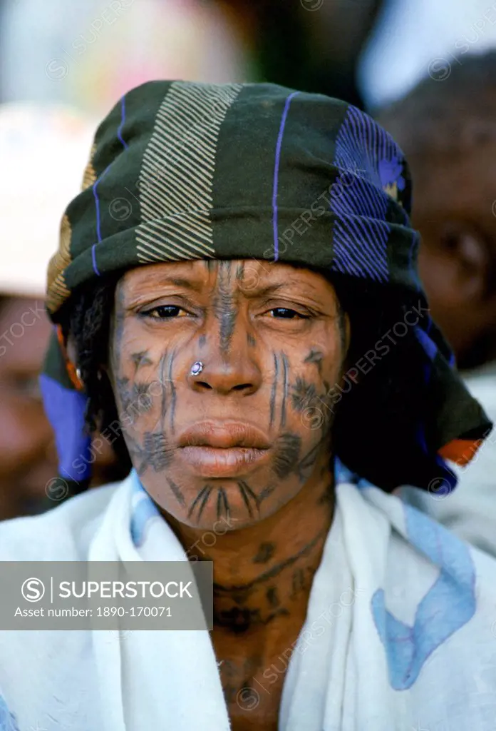 Nigerian local with face markings at tribal gathering cultural event in Nigeria, West Africa