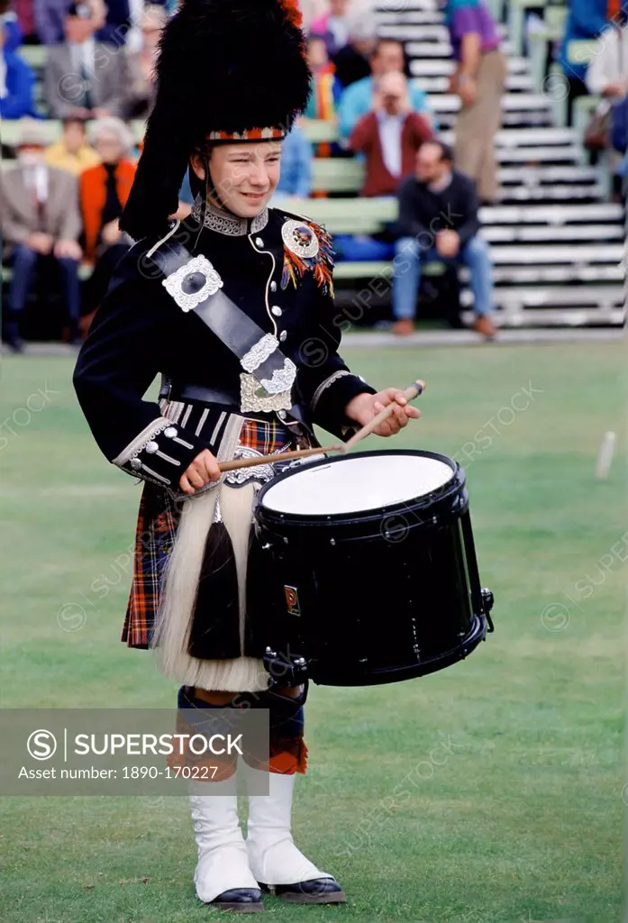 Traditional Scottish drummer in kilt, bearskin and sporran at the Braemar Royal Highland Gathering, the Braemar Games in Scotland