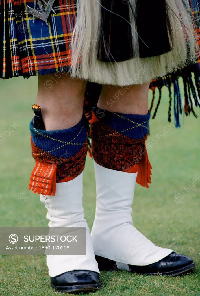 Traditional Scottish kilt and sporran with dirk dagger in sock at the Braemar Royal Highland Gathering, the Braemar Games in Scotland