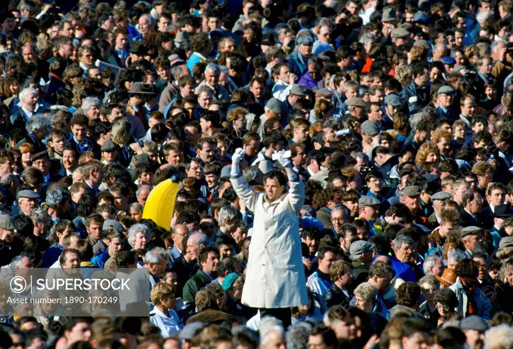 Tic-Tac man with white gloves and old method signals bookmakers odds for betting at Cheltenham Racecourse National Hunt Festival of Racing, UK