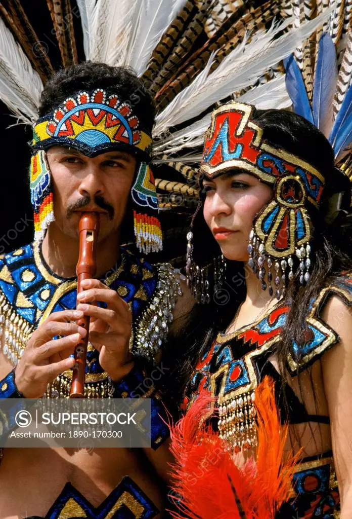 Musicians in Mexican Aztec Indian traditional costumes in Los Angeles, California, USA