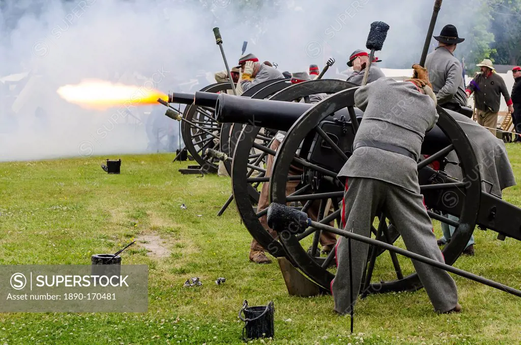 Confederate artillery unit cannon action during Thunder on the Roanoke Civil War reenactment in Plymouth, North Carolina, United States of America, No...