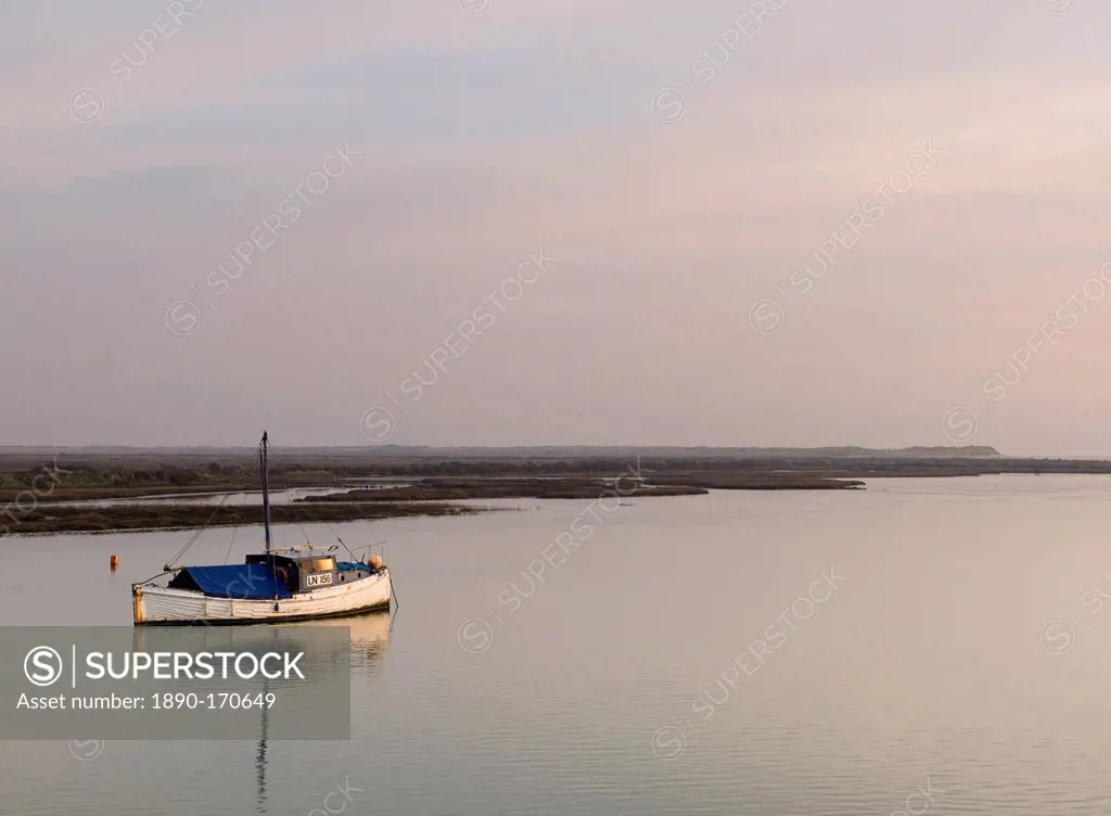 A loan boat in the tidal channel at Burnham Overy Staithe, Norfolk, England, United Kingdom, Europe