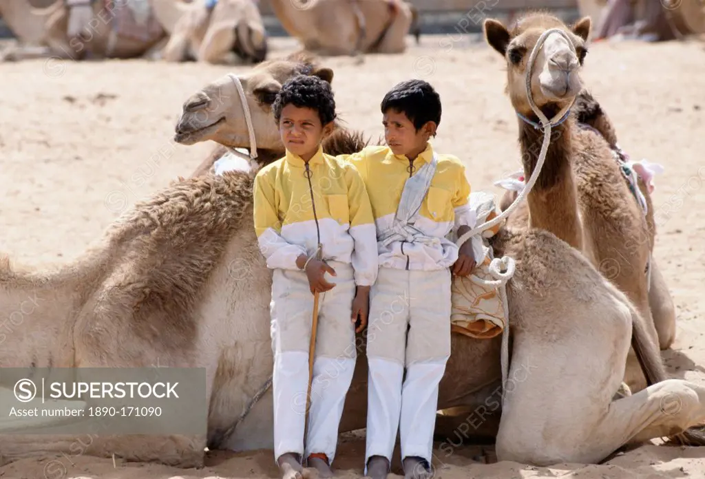 Camel racing boy jockeys at Al Ain in Abu Dhabi, United Arab Emirates, Middle East