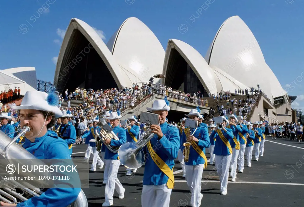 Carnival parade and musical band for celebrations at Sydney Opera House by Sydney Harbour Bridge for Australia's Bicentenary,1988
