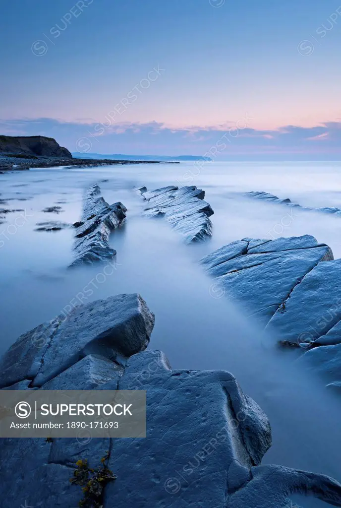 Twilight skies above rocky coast at Kilve Beach, Somerset, England, United Kingdom, Europe