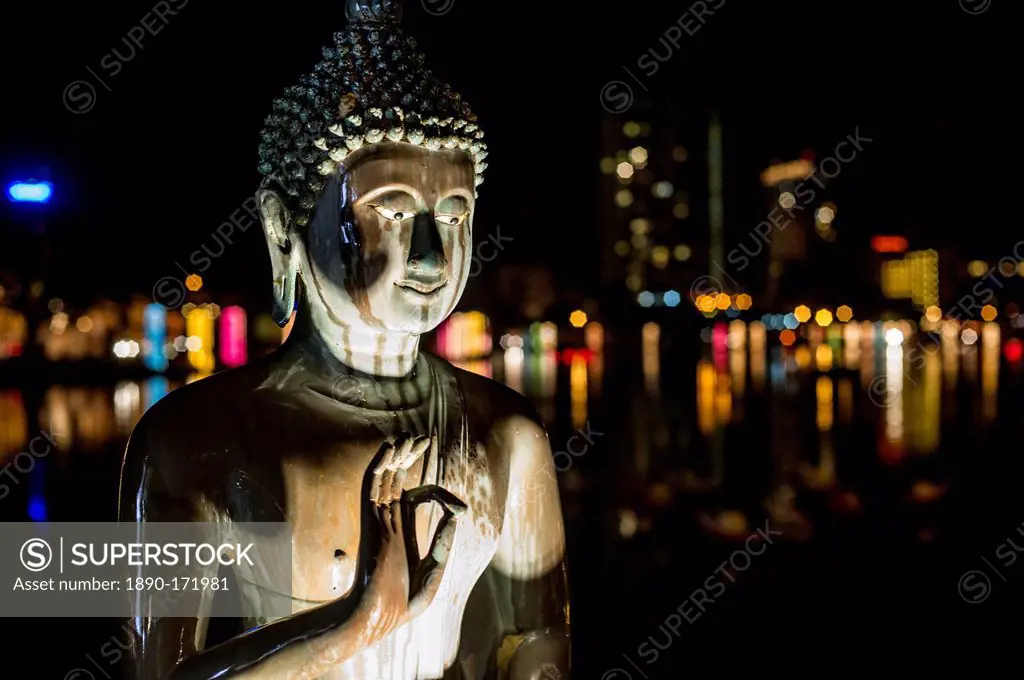A statue of Buddha at Vesak, a festival to celebrate Buddha's birthday in Gangaramaya Temple, Colombo, Sri Lanka, Asia