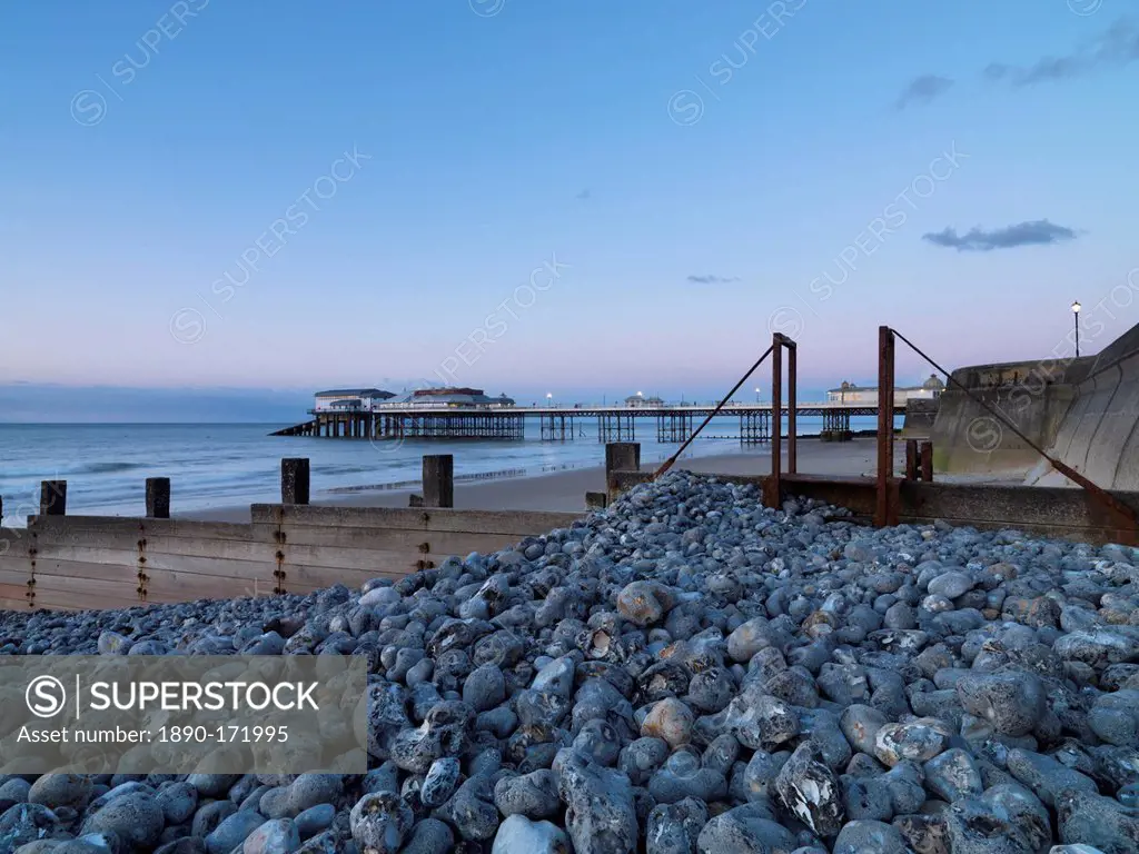 A twilight view of the beach and pier at Cromer, Norfolk, England, United Kingdom, Europe