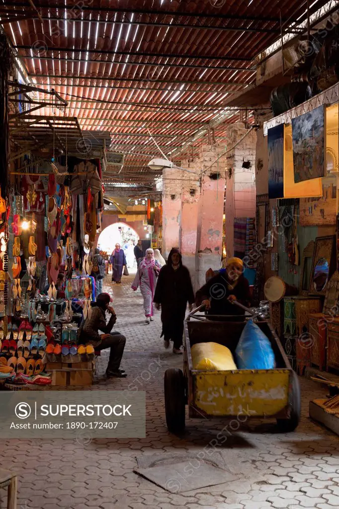 People in traditional dress walking through the souks, Marrakech, Morocco, North Africa, Africa