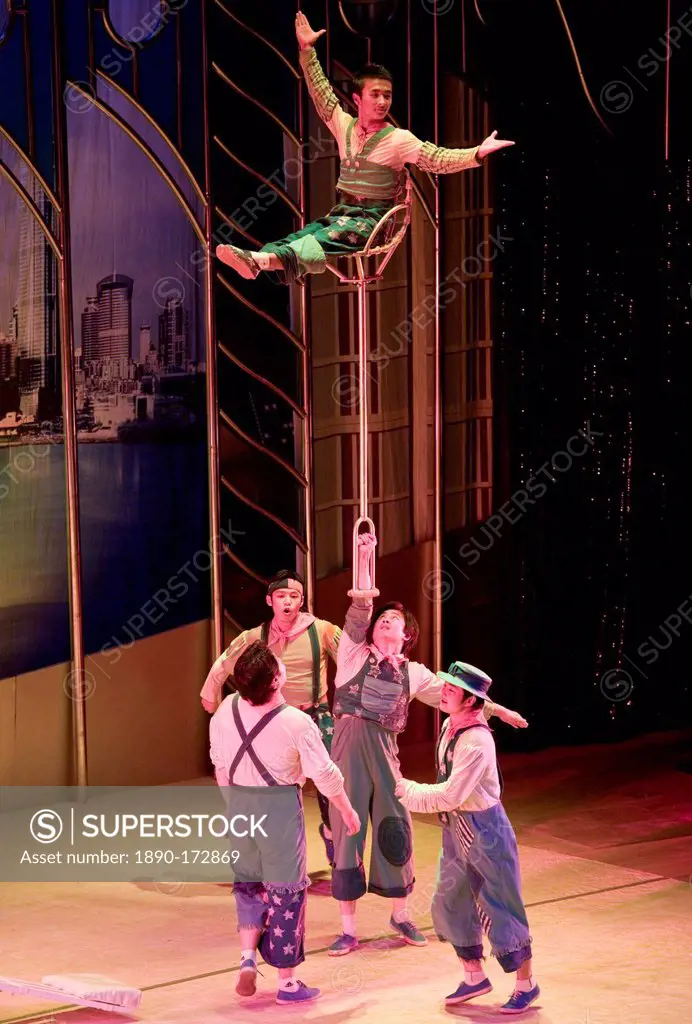Members of the Shanghai Acrobatic Group performing on stage at the Shanghai Centre Theatre, China