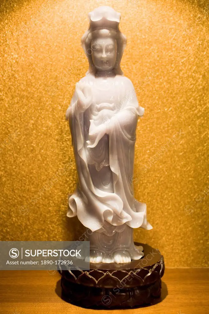 Lavender jade Goddess of Mercy figurine on display in the Huahui Jade Factory and Showroom, Xian, China