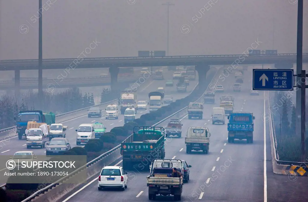Traffic and pollution on motorway near the financial district of Xian, China
