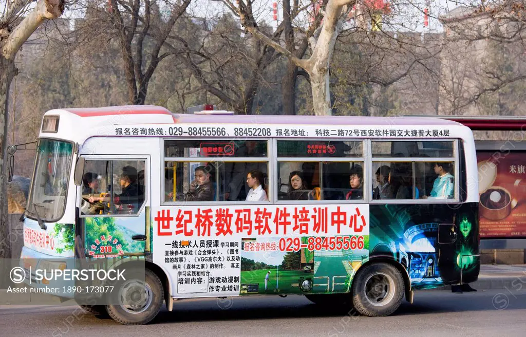 Bus carries workers home in rush hour, Xian city centre, China