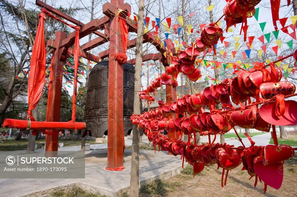 Prayers wishes and greetings tied by the Buddhist morning prayer bell, Small Wild Goose Pagoda, Xian, China