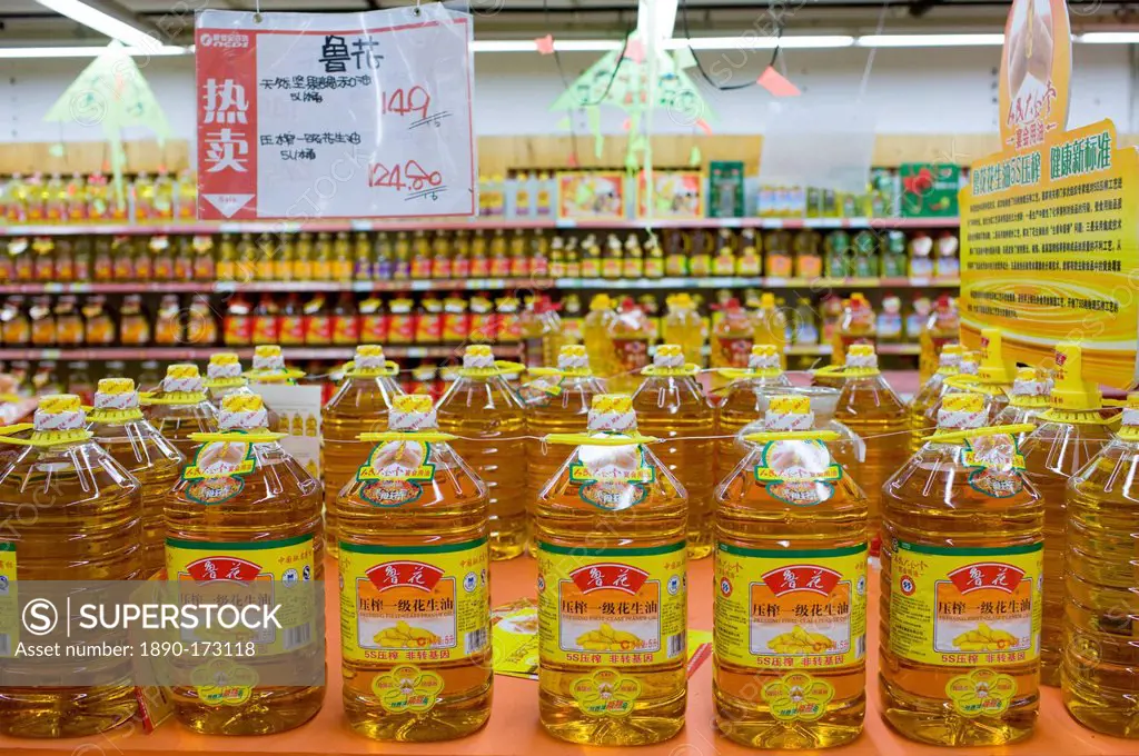 Peanut cooking oil in supermarket, Chongqing, China. The Chinese use a lot of edible oil and find it expensive.