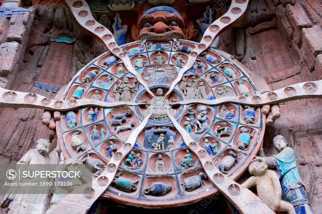 Anicca, God of Destiny holds wheel of life of Buddhist Karma, Dazu rock carvings, Mount Baoding, China