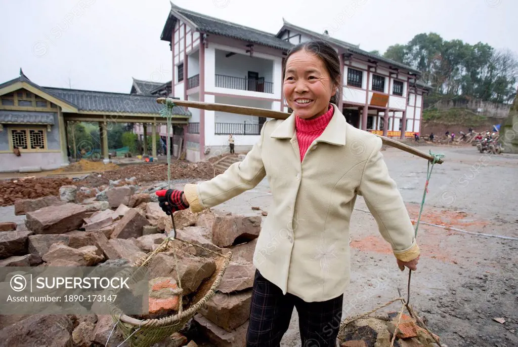 Woman at work building new tourist centre at Dazu Rock Carvings, Mount Baoding, Chongqing, China