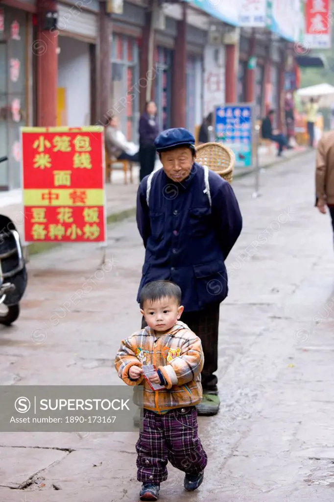 Grandfather with grandson at Baoding, Chongqing. China has one child family planning policy to reduce population.
