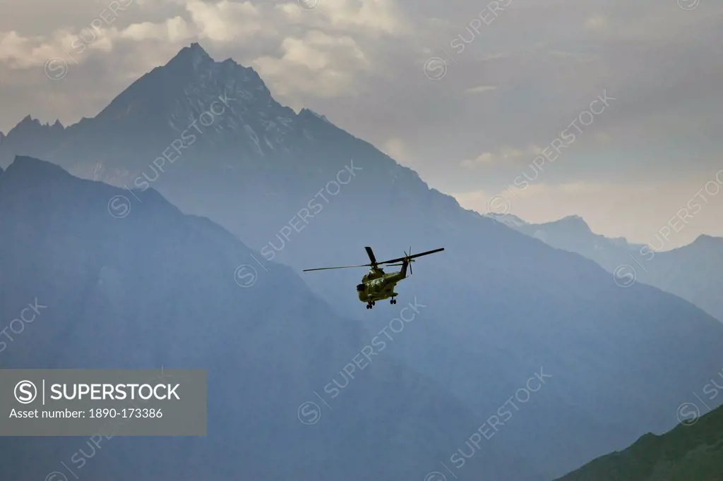 Helicopter flies through valleys of Karokoram Mountains, Skardu Valley, North Pakistan