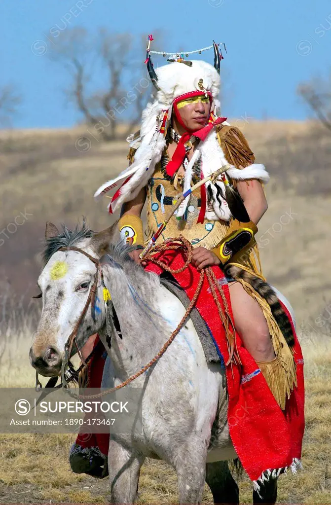 Canadian Plains Indians chief on horseback at cultural display at Wanuskewin Heritage Park in Saskatoon, Canada