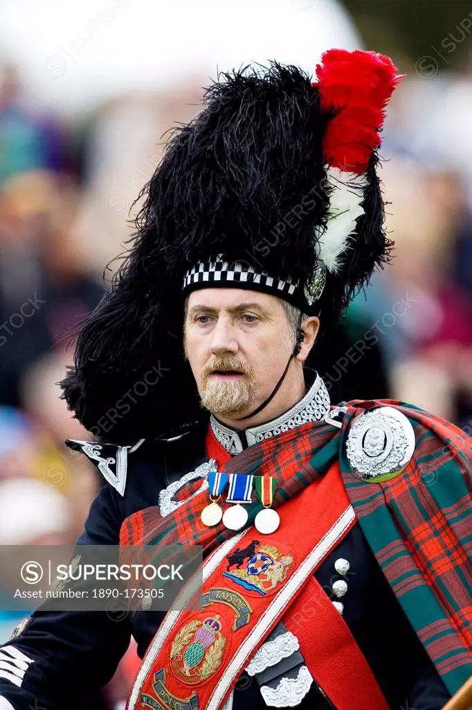 Drum Major of massed band of Scottish pipers at Braemar Games Highland Gathering, Scotland