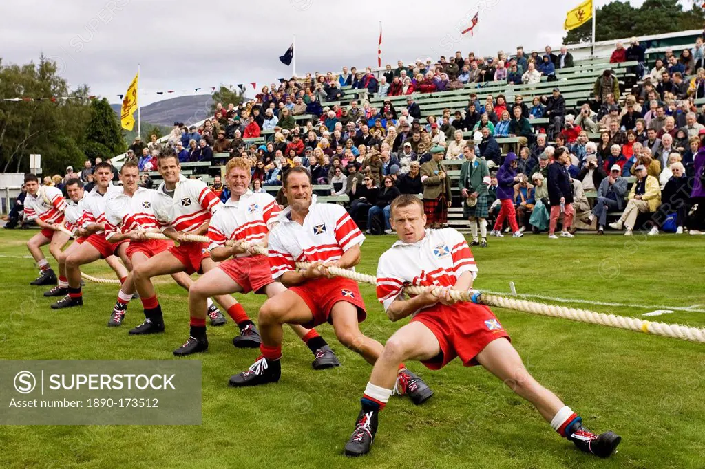 Men compete in Tug O' War contest at the Braemar Games Highland Gathering, Scotland, UK
