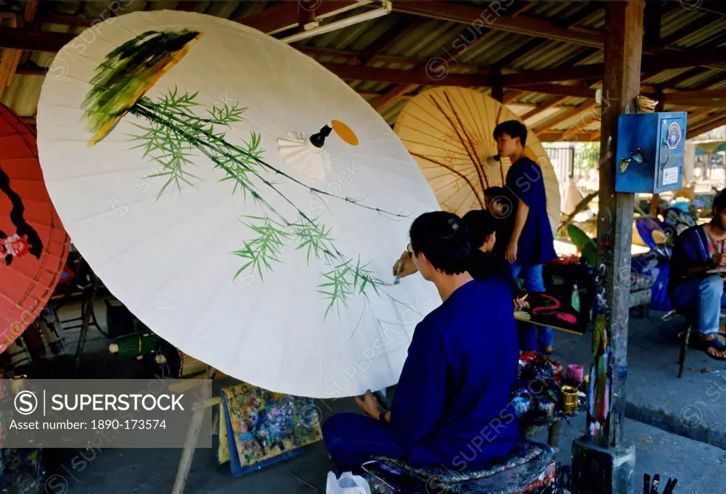 Painting sun umbrellas, Chaing Mai, Thailand.