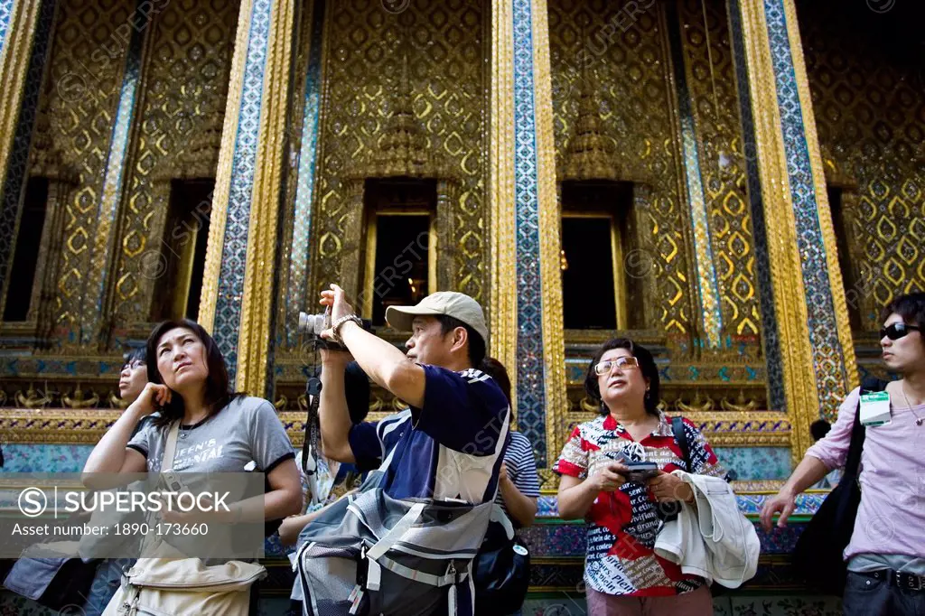 Tourists visit the Grand Palace Complex in Bangkok, Thailand