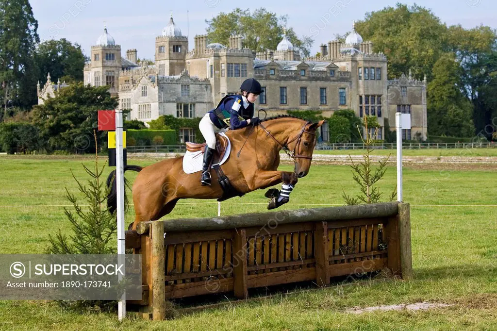 Horse and rider in the cross-country phase of an eventing competition, Charlton Park, Wiltshire, United Kingdom