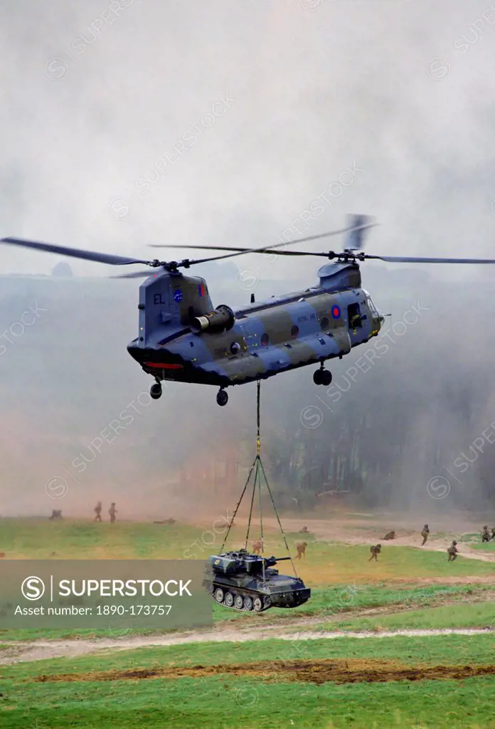 Chinook helicopter lifts a tank at display given by the 5th Airborne Brigade at Salisbury Plain, Wiltshire, UK