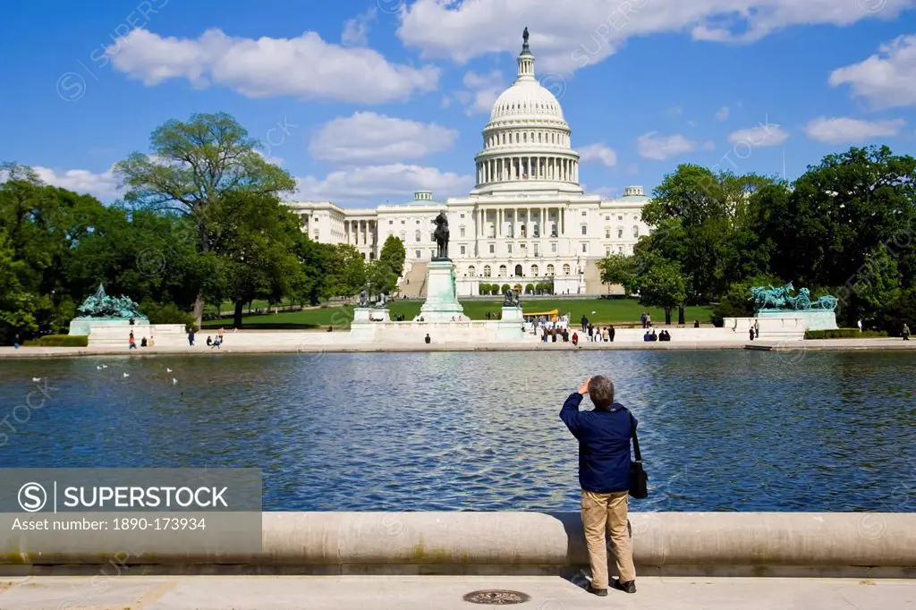 Tourist takesphotograph of The United States Capitol, Washington DC, United States of America