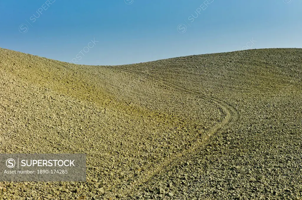Tuscan parched landscape sun-baked soil in Val D'Orcia, Tuscany, Italy