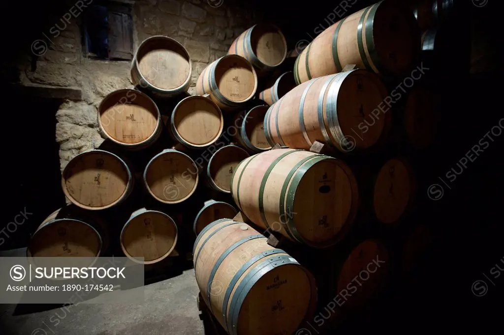 Rioja wine in American oak barrels in cave at Bodegas Agricola Bastida in Rioja-Alaveda area of Basque country, Spain