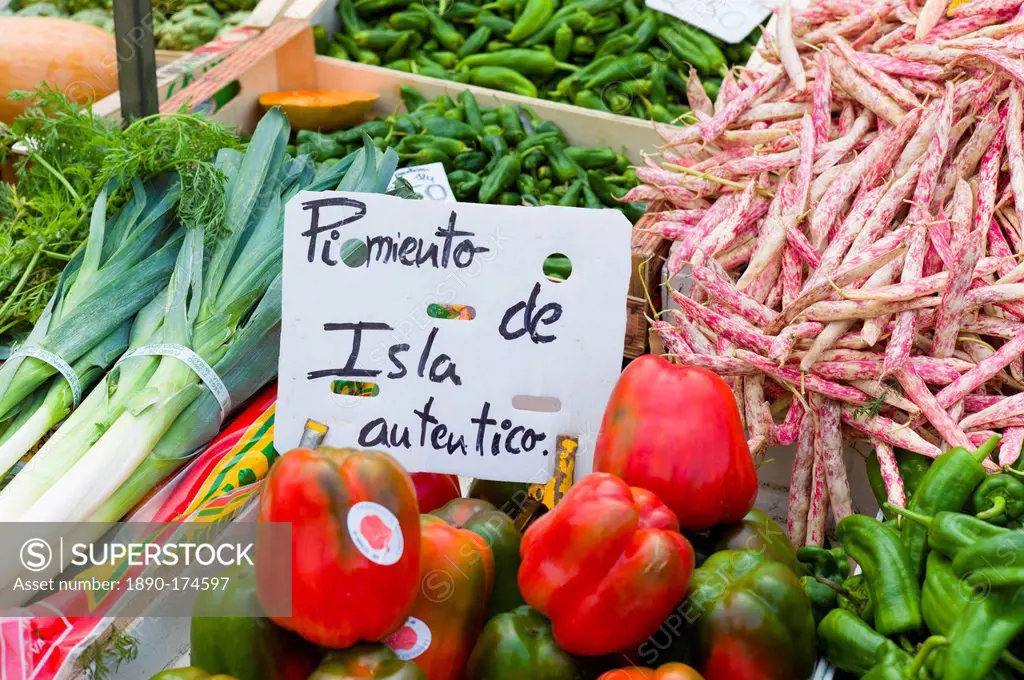 Pimentos, leeks, demi-sec beans of Cantabria on sale in food market in Santander, Northern Spain