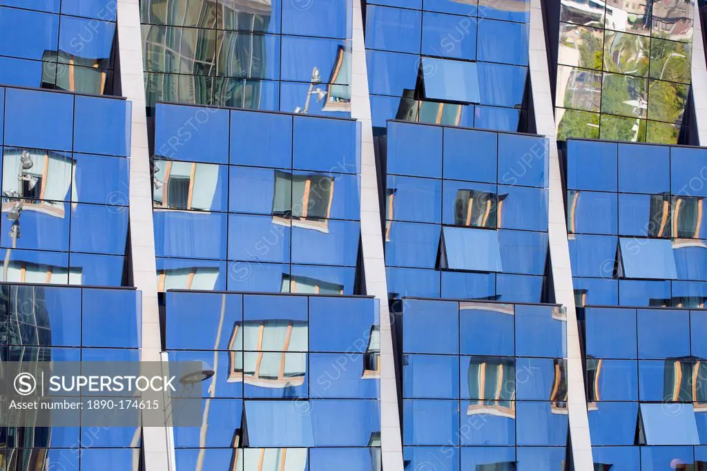 Reflections in the futuristic glass-fronted Silken Gran Hotel at Bilbao, Basque country, Spain