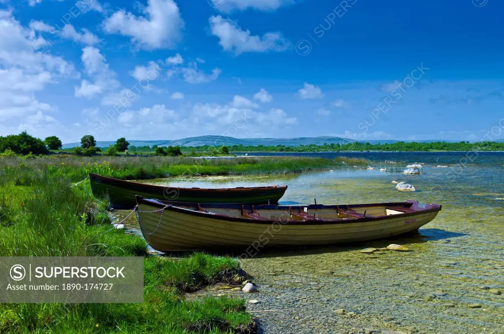 Boats among the reeds at Lough Muckanagh, County Clare, West of Ireland