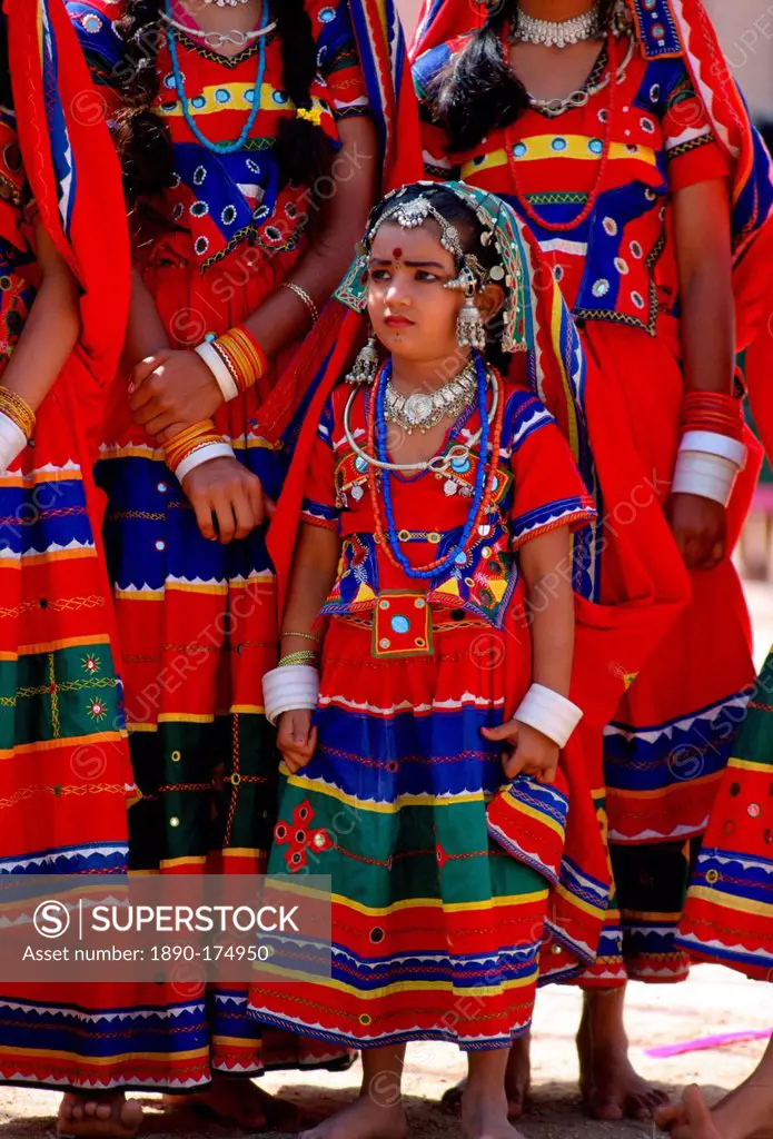 Young pretty girls in brightly coloured national costume and jewels at a festival in Calcutta, India