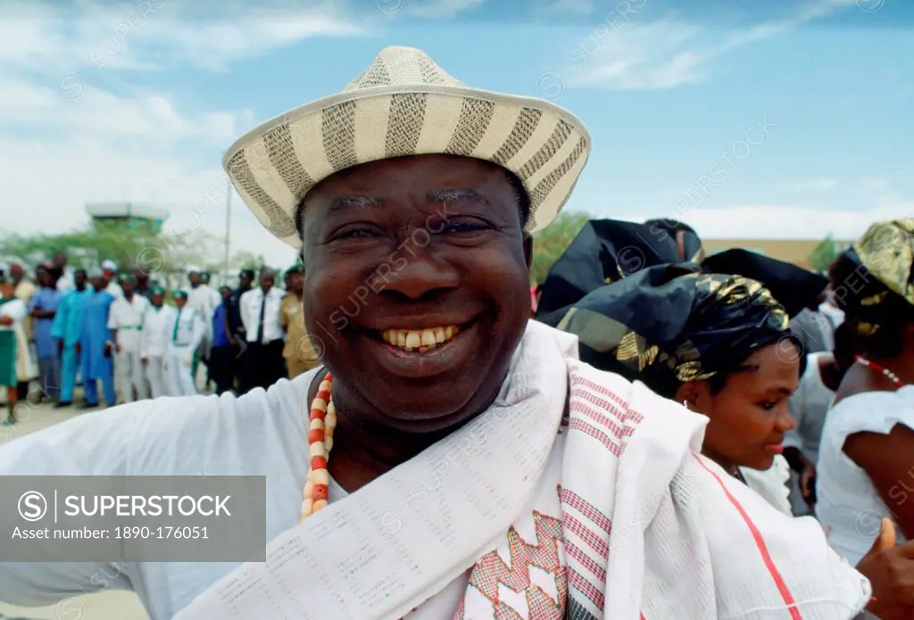 A happyl, smiling Nigerian man waiting for friends at Maiduguri Airport in Nigeria