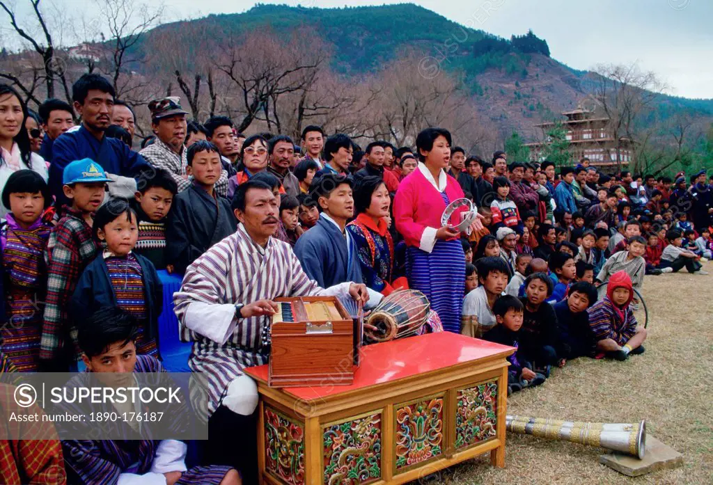 Musicians and spectators at dance and archery festival, Paro, Bhutan