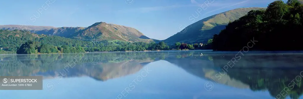 Perfect reflection in early morning, Grasmere, near Ambleside, Lake District, Cumbria, England, United Kingdom, Europe