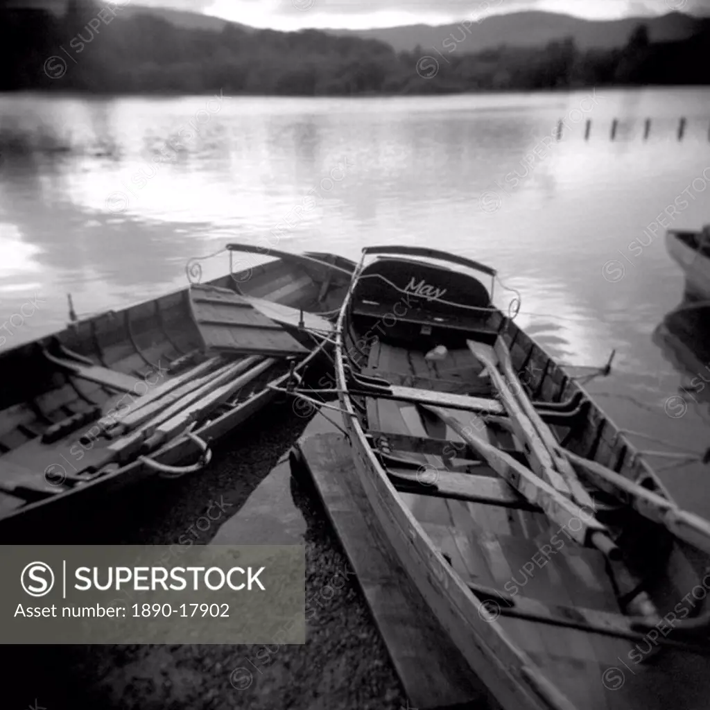 Image taken with a Holga medium format 120 film toy camera of two old boats by lake side, Derwentwater, Lake District National Park, Cumbria, England,...
