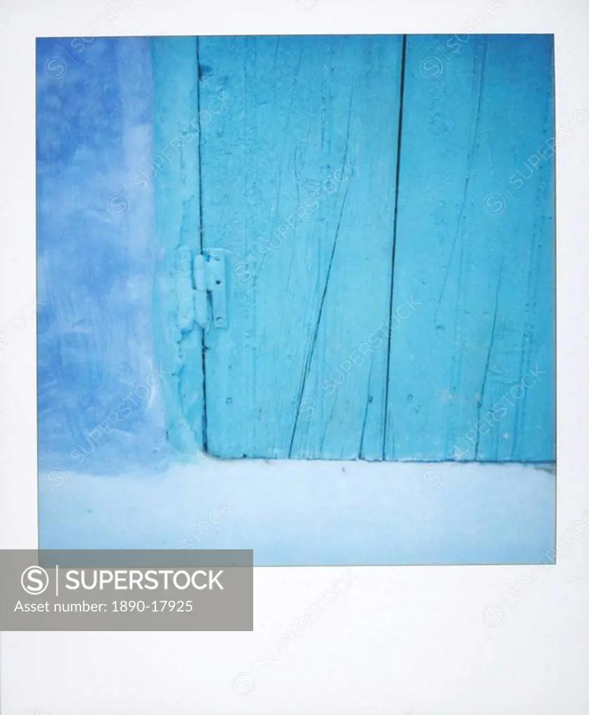 Polaroid of detail of a traditional painted blue door against bluewashed wall, Chefchaouen, Morocco, North Africa, Africa