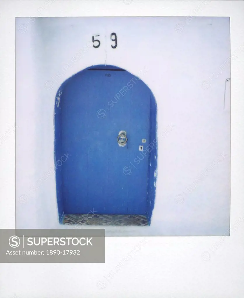 Polaroid of traditional painted blue door against whitewashed wall, Chefchaouen, Morocco, North Africa, Africa